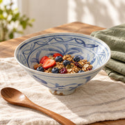 AI-assisted concept image of cobalt blossom conical bowl: styled table view; food and props are not included.