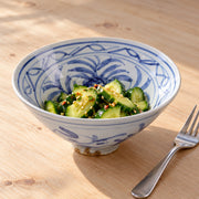 AI-assisted concept image of cobalt blossom conical bowl: styled setting view; food and props are not included.