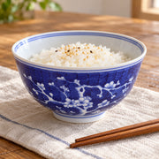 AI-assisted concept image of cobalt plum blossom deep bowl: styled table view; food and props are not included.
