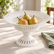 AI-assisted concept image of ivory openwork pedestal compote: styled table view; food and props are not included.