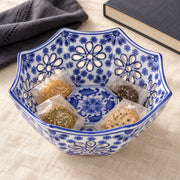 AI-assisted concept image of cobalt octagonal openwork fruit bowl: styled setting view; food and props are not included.