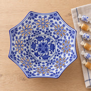 AI-assisted overhead concept image of one cobalt octagonal openwork bowl beside wrapped sweets; sweets are not included.