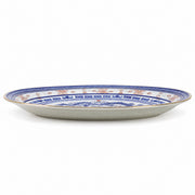 AI-assisted concept image of dragon & rice-grain oval platter: side profile.