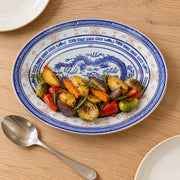 AI-assisted concept image of dragon & rice-grain oval platter: styled table view; food and props are not included.