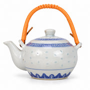 AI-assisted concept image of rice-grain teapot — orange handle: overall product view.