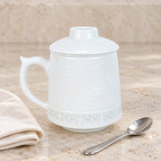 AI-assisted concept image of linglong landscape infuser mug: styled table view; food and props are not included.