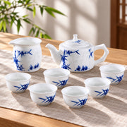 AI-assisted concept image of the complete Bamboo Linglong eight-piece tea set on a styled table; props are not included.