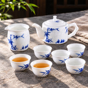 AI-assisted concept image of the teapot, pitcher and six cups from the Bamboo Linglong tea set in an outdoor setting.