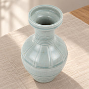 AI-assisted concept image of pale green ring-neck vase: styled editorial view; food and props are not included.